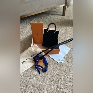 NWT Louis Vuitton Petit Sac Flat. Never used. Box, tags, ribbon, and receipt.